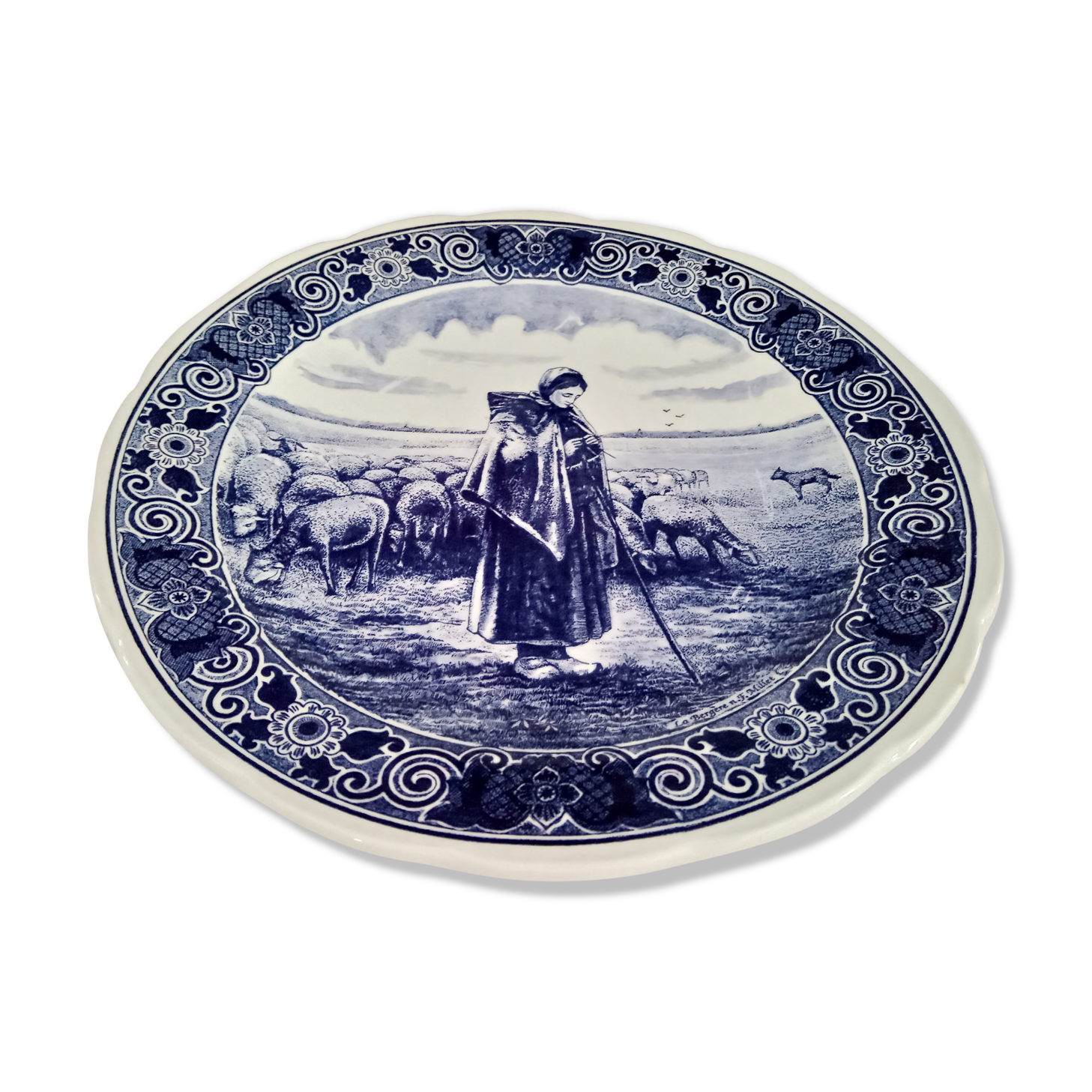 Round dish hollow Delfts decorating shepherdess and her sheep