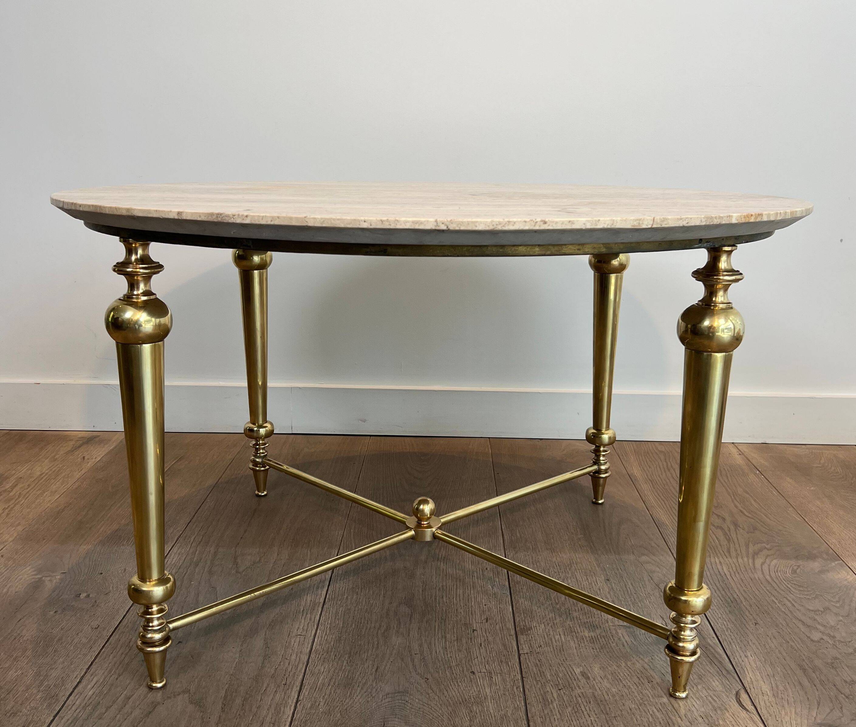 Brass coffee table with a white marble top.