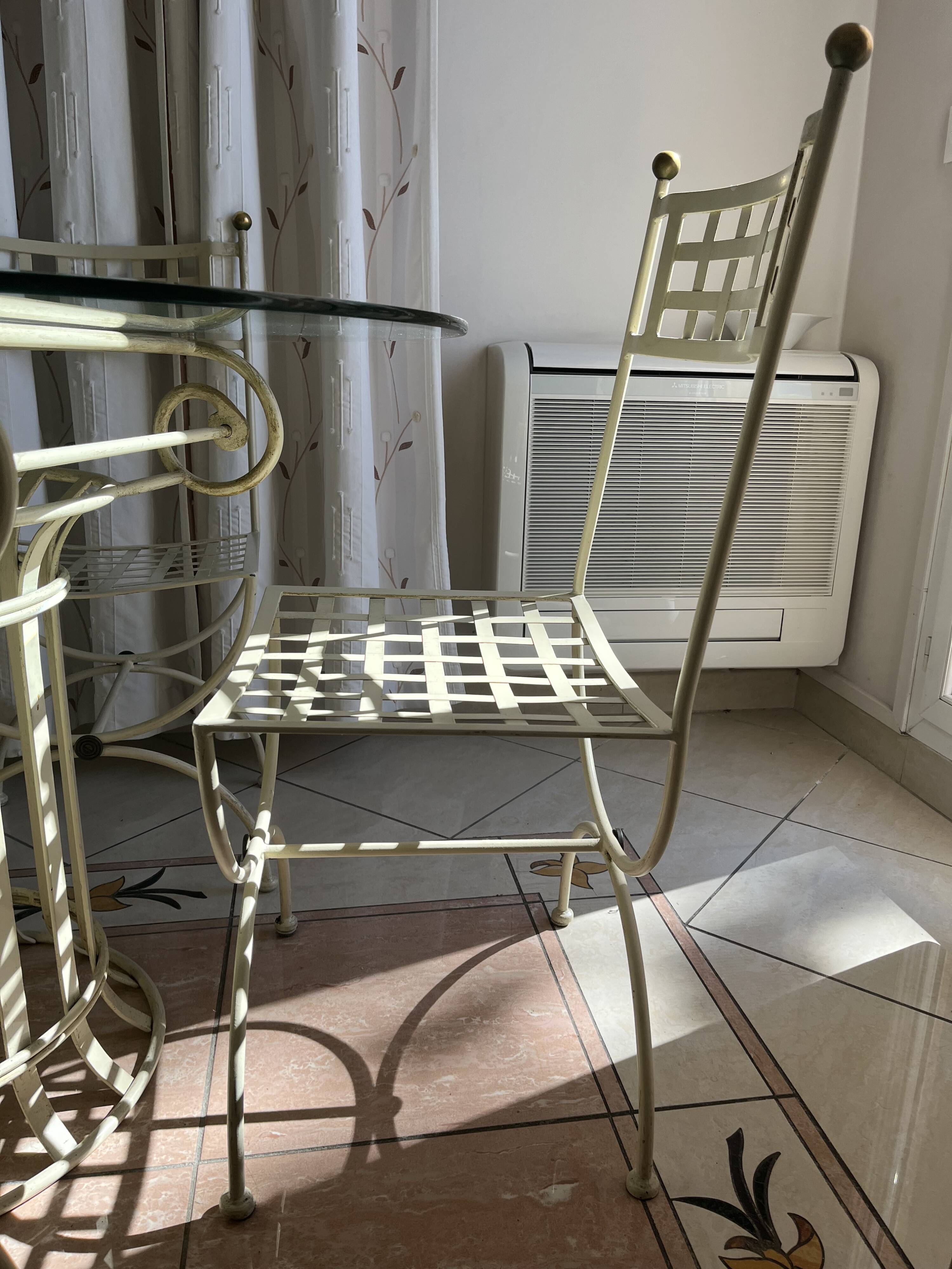 Wrought iron round table and 4 chairs