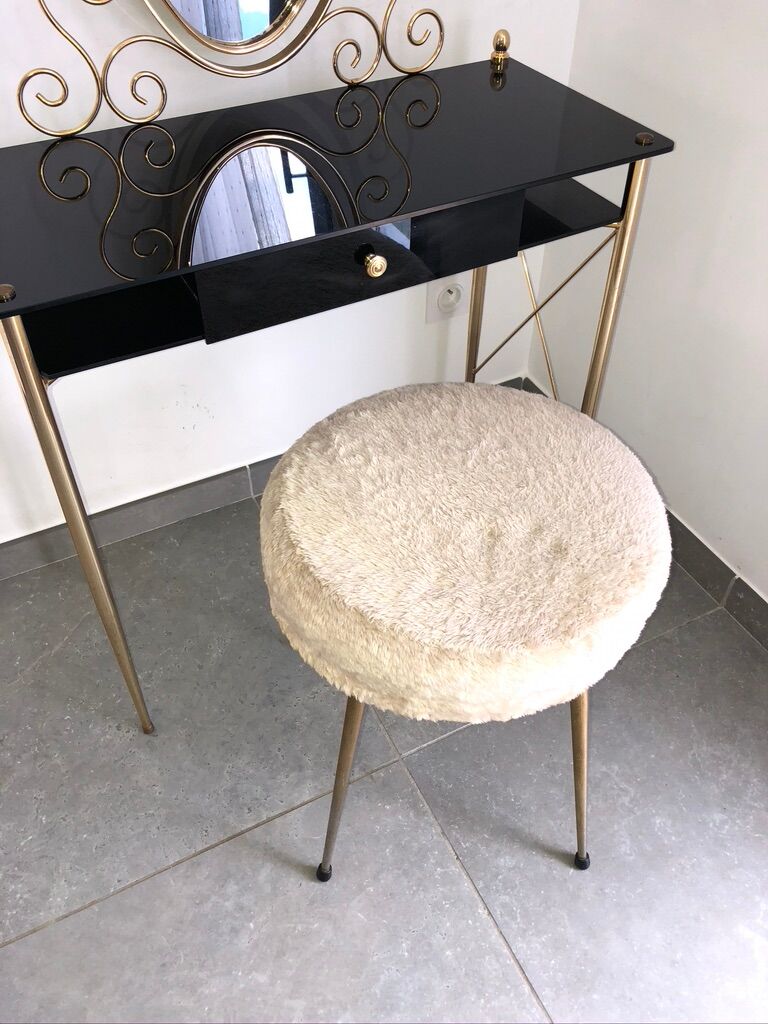 Brass hairdresser, glass and black plastic with its fluffy stool.