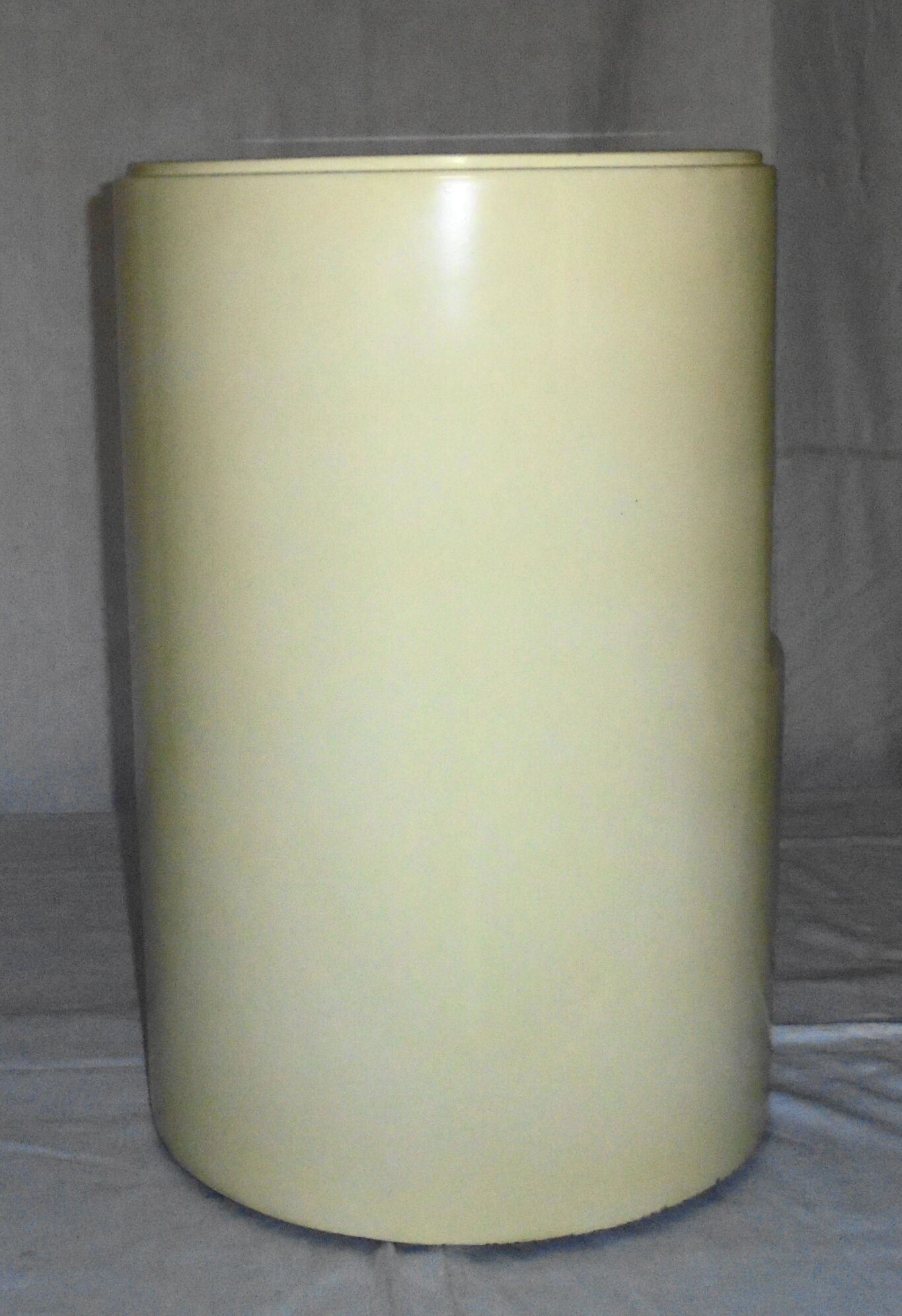 Cylindrical fiberglass bedside table from the 60s