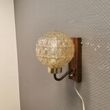 Wall light in rosewood with bobble glass ball shade.