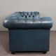 Chesterfield sofa buttoned in blue cowhide, 2.5 seats