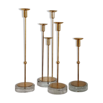 Gunnar Ander, four candlesticks, brass and glass, Ystad Metall, Swedish modern.