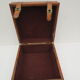 Rectangular wooden suitcase covered with leather