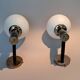 Pair of wall lights in gilded and black lacquered brass, Italy 1970/1980.