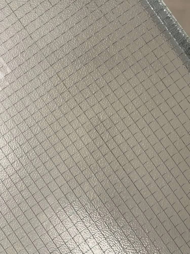 Minimalist 1960s wire glass coffee table in stainless steel.