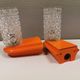 Bathroom lamps in a nice orange colour with a crystal glass shade and a base of hard thin plastic