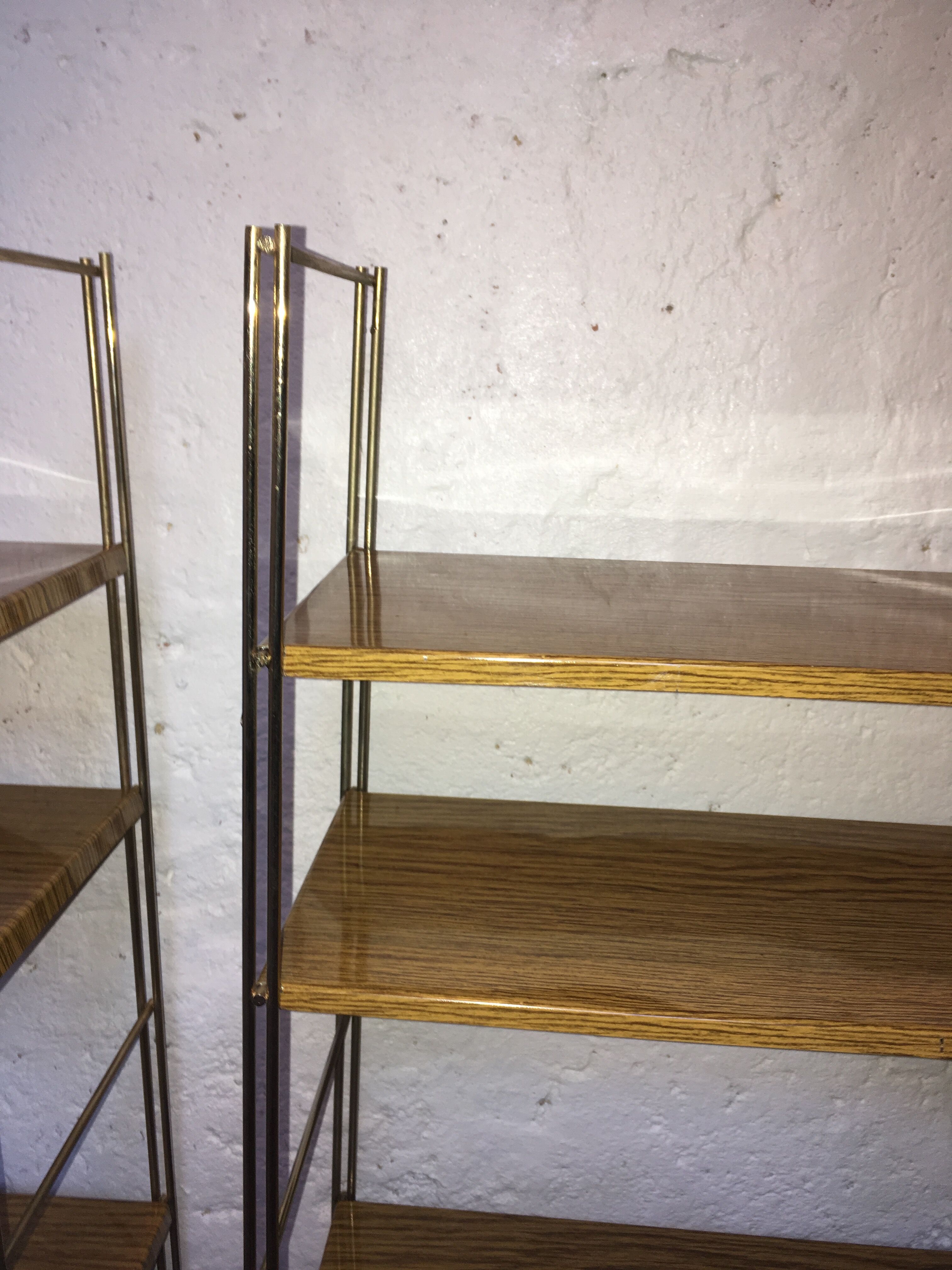 set of two 1960 vintage metal thong shelves.