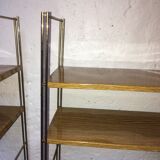 set of two 1960 vintage metal thong shelves.