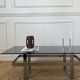 Table basse en acier chromé et plateau en verre fumé design 70
