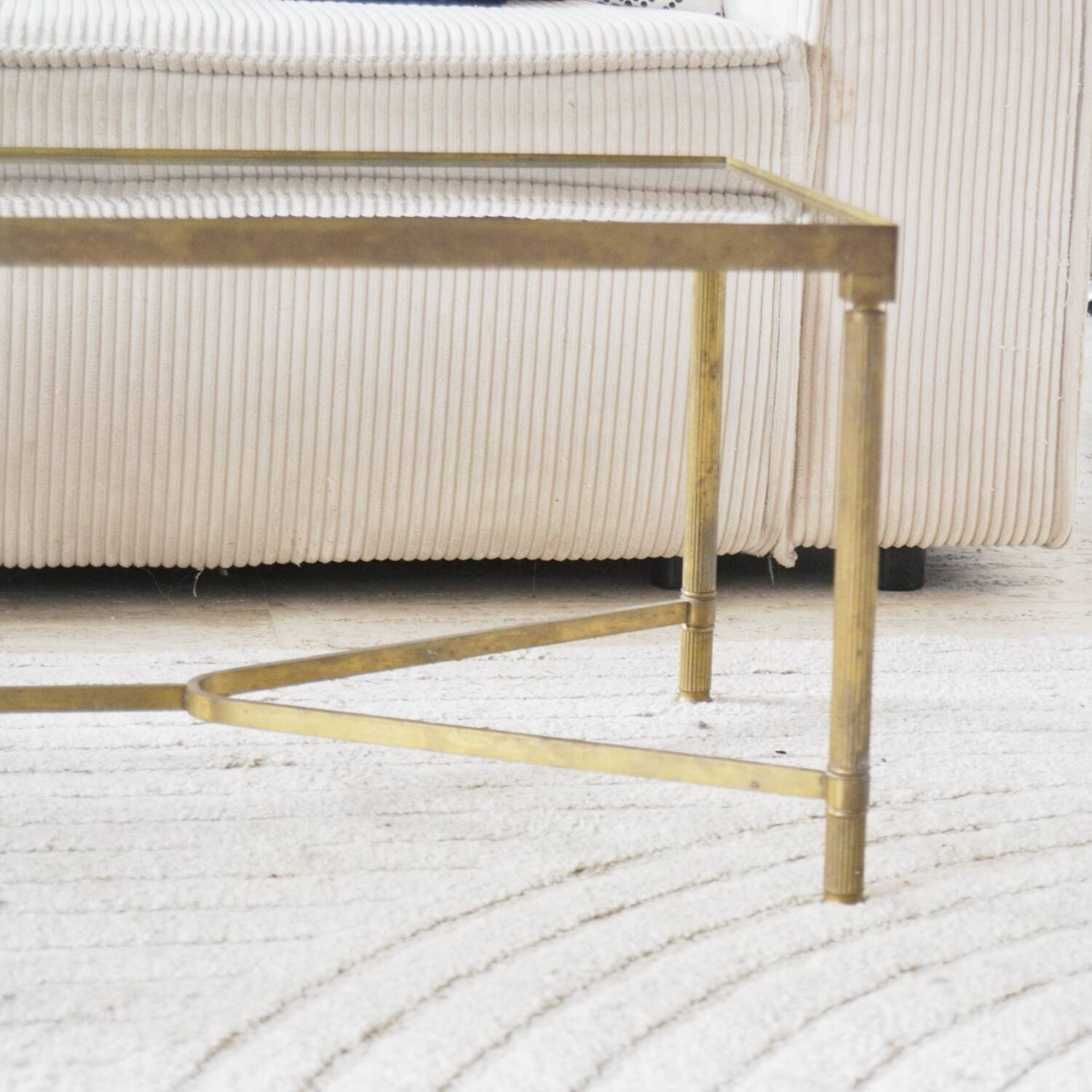 Coffee table in gold metal and glass