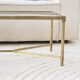 Coffee table in gold metal and glass