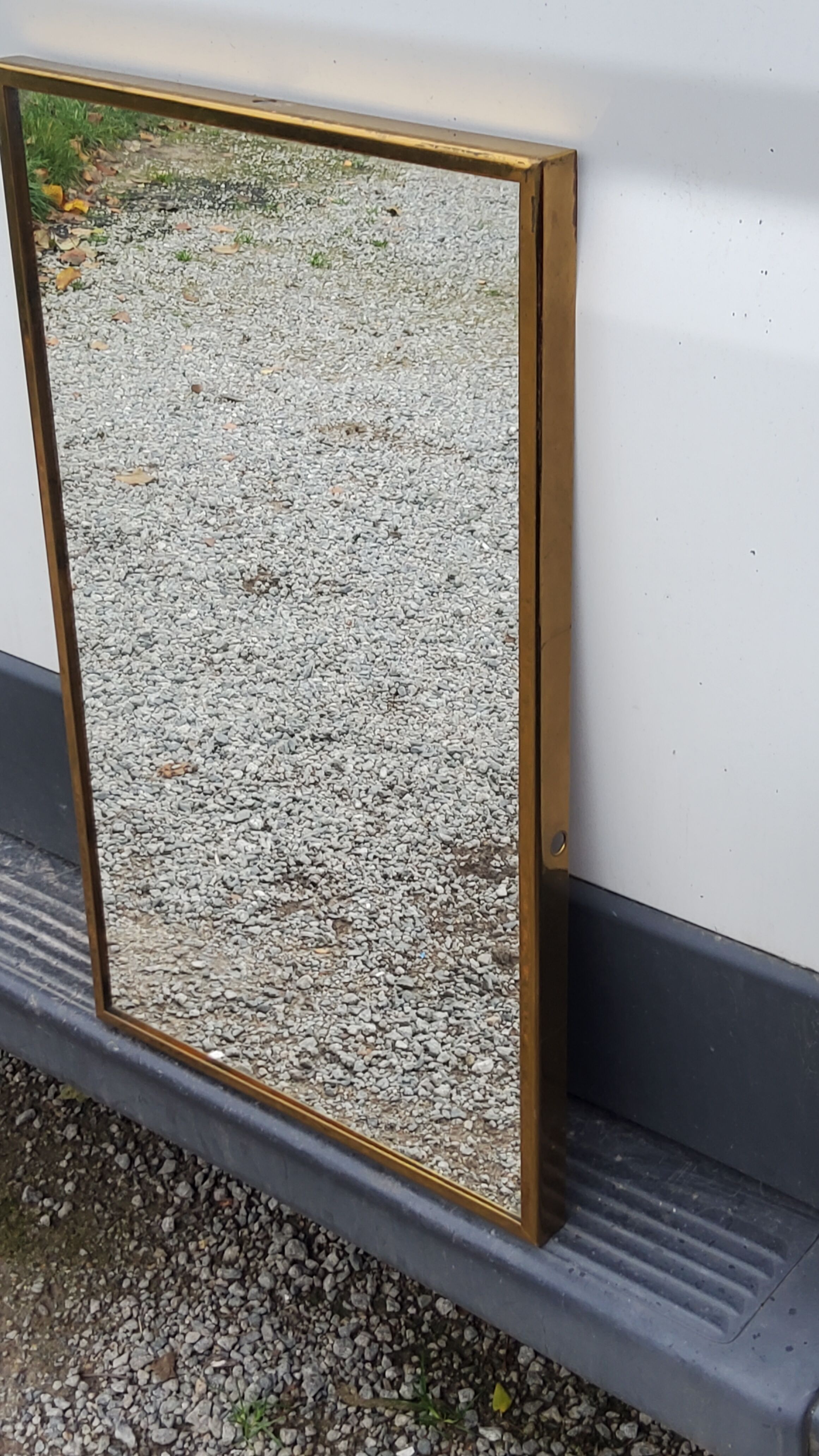 Mirror of the 70s in gilded metal, 60x35 cm