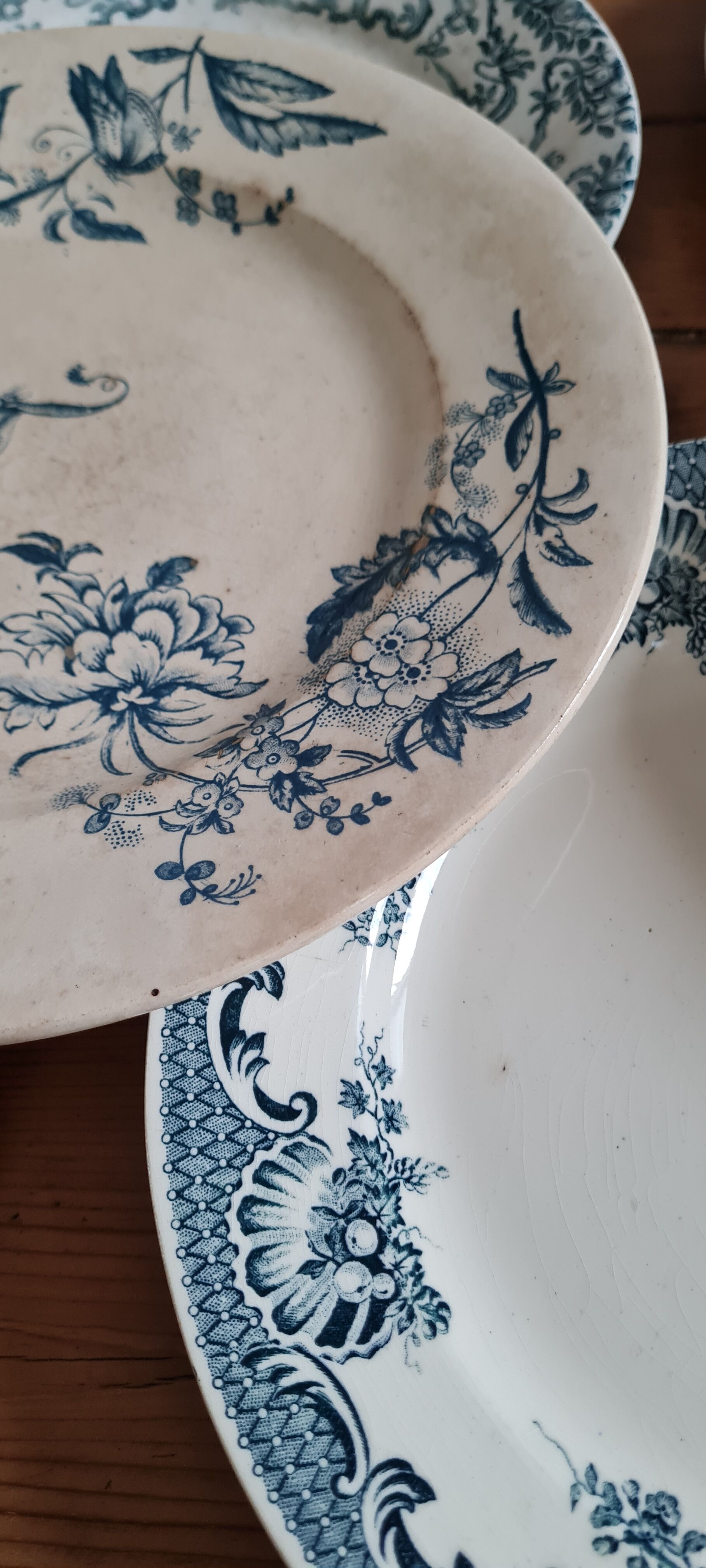 Set of 7 mismatched plates in iron earth