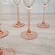 6 champagne flutes with pink stems
