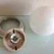 Plafonnier globe en opaline blanche et métal brossé