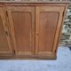 Oak workshop furniture with sliding doors.