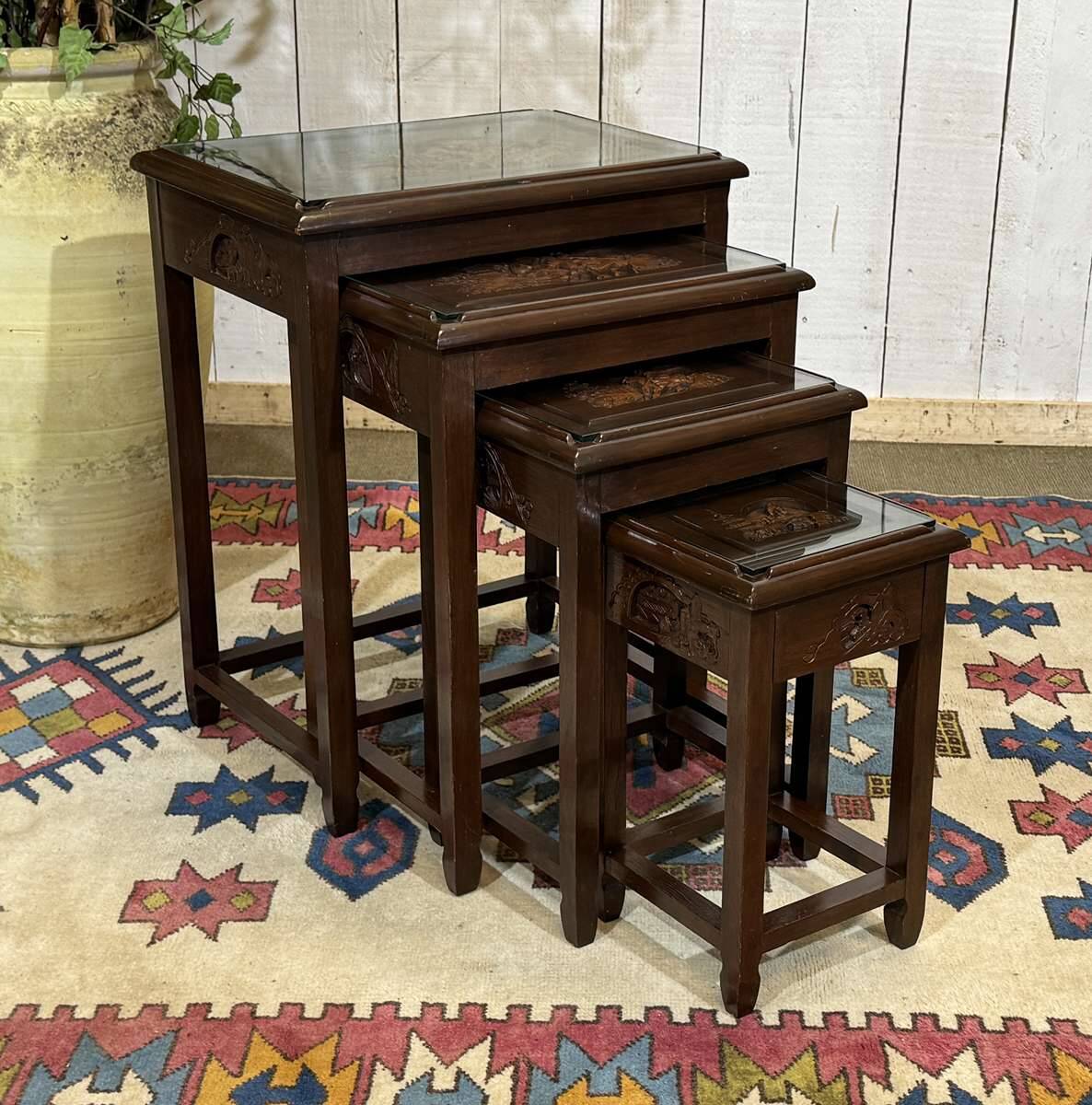 Set of 4 Chinese nesting tables in teak from the 1980s.