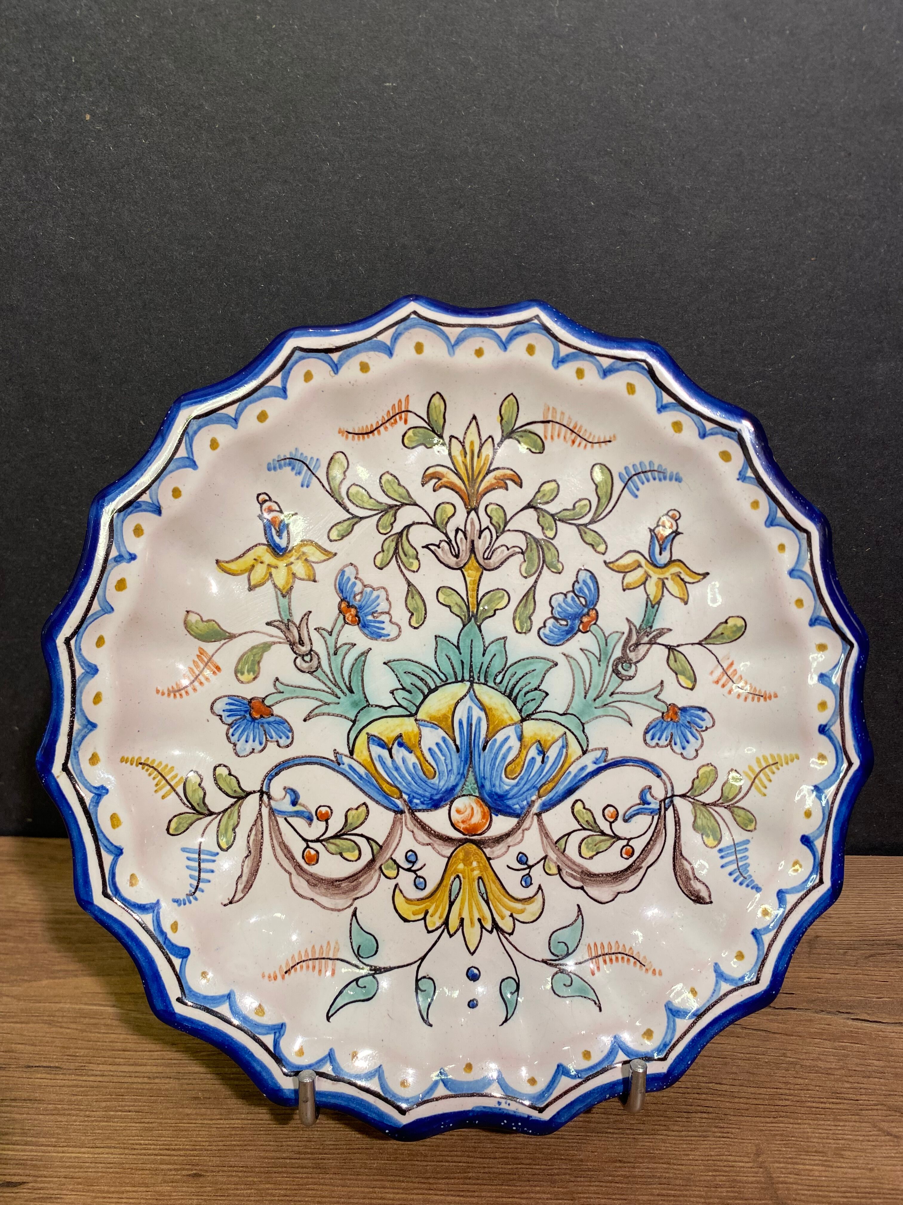 Pair of plates with floral decoration in Nevers earthenware signed Montagnon