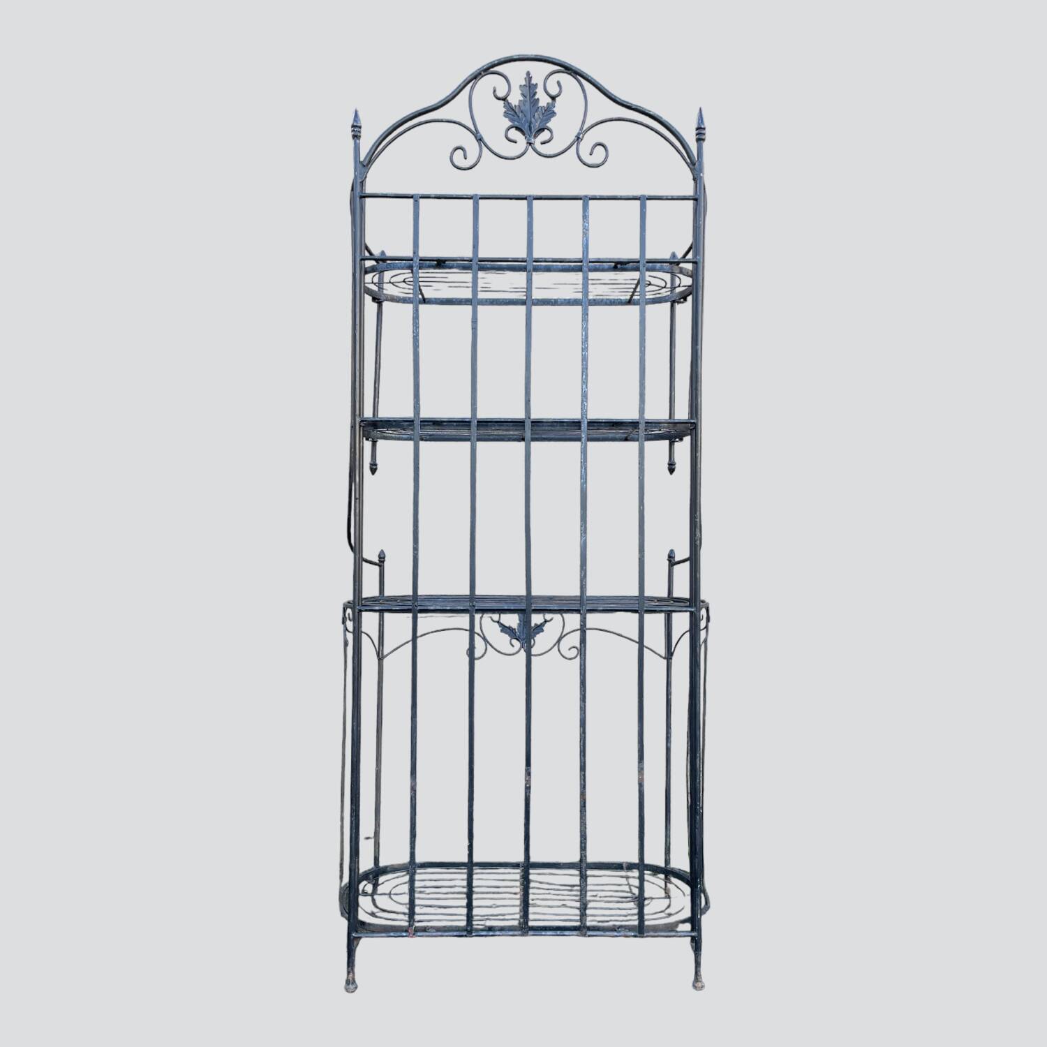 Old wrought iron garden shelf for plants