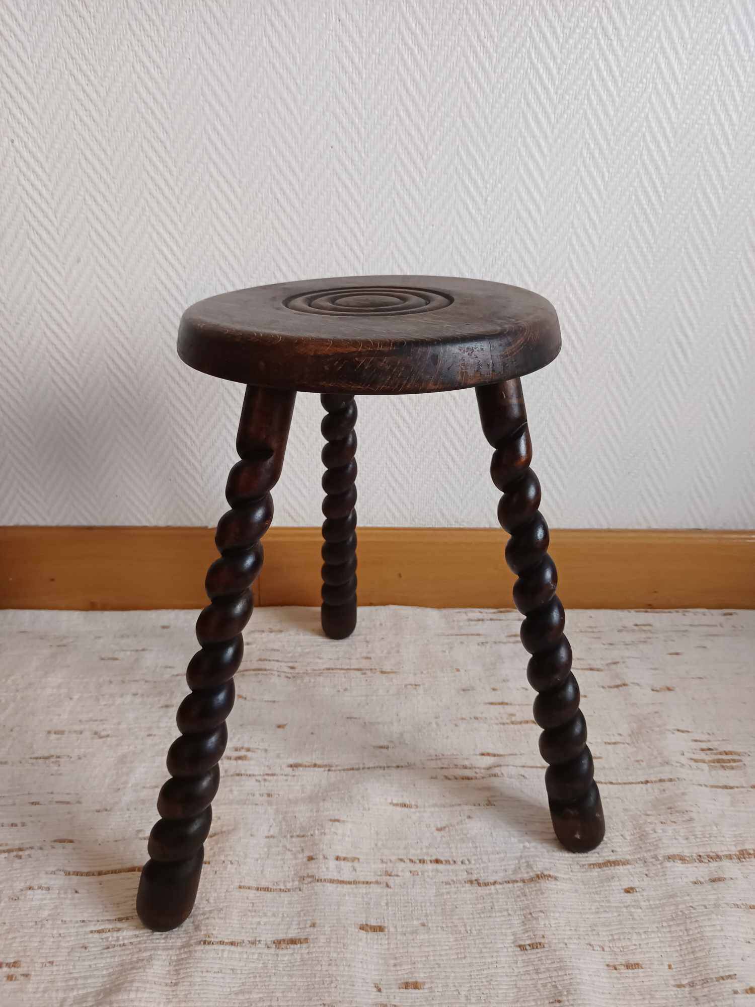 Brutalist tripod stool with twisted legs