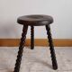 Brutalist tripod stool with twisted legs