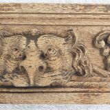 Natural wood pediment with bunches of grapes