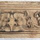 Natural wood pediment with bunches of grapes