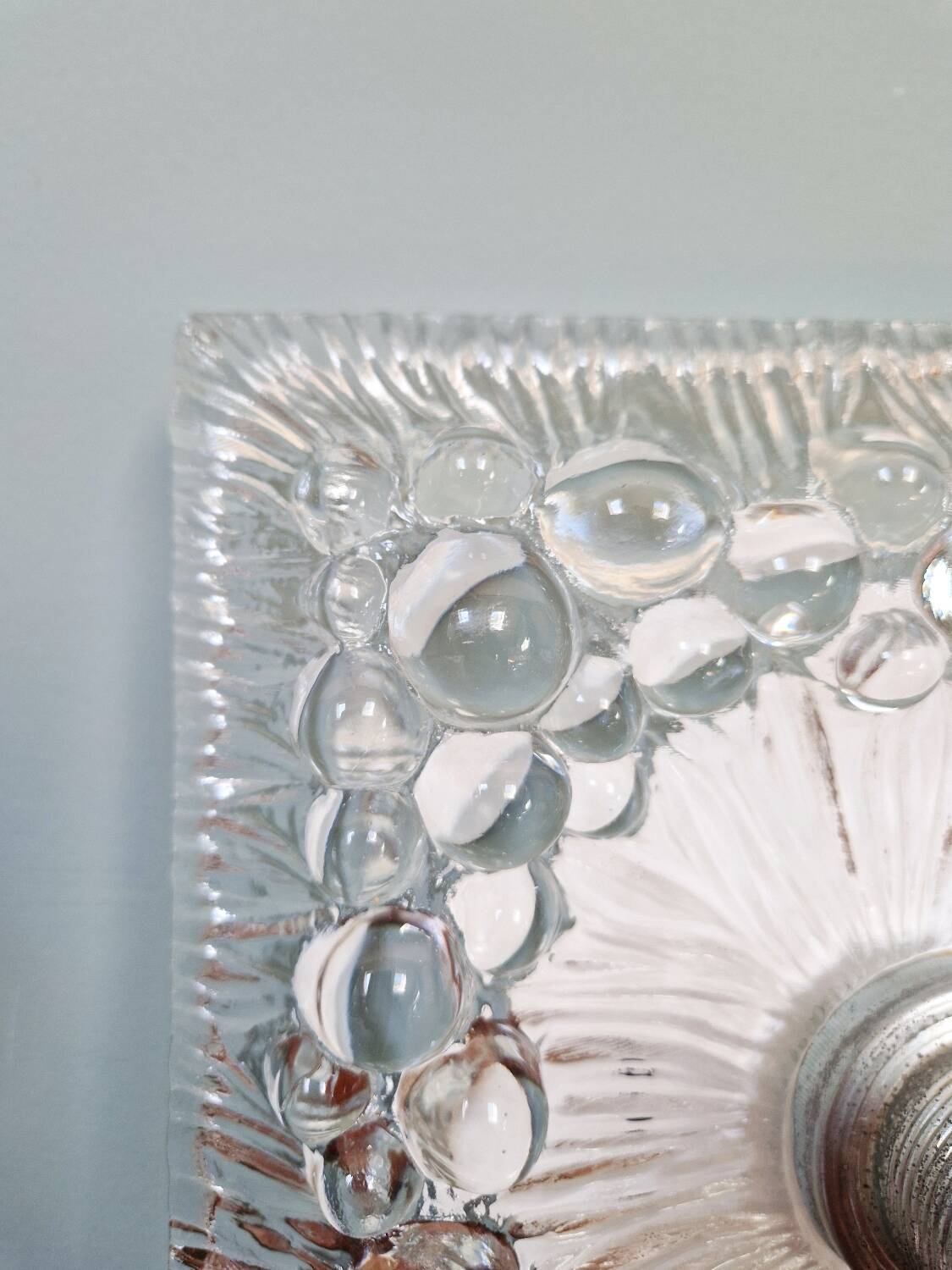 Space Age wall light in pressed transparent moulded glass, 1970.