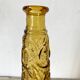 Bouteille, vase en verre ambré anges