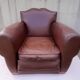 Club armchair in brown skai back mustache