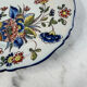 Flat plate in earthenware with polychrome decoration in Rouen style