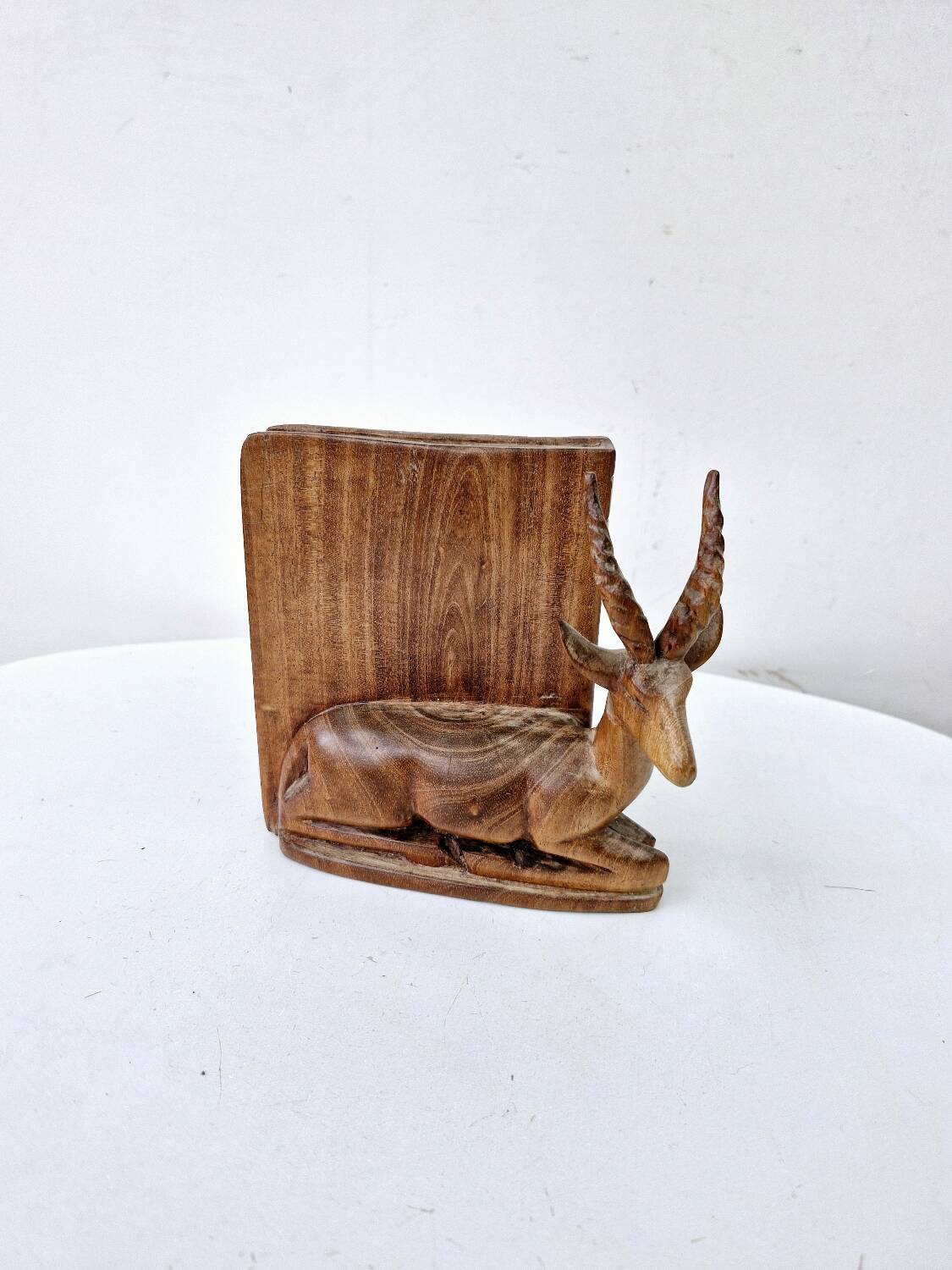 Old antelope bookend in hand carved wood