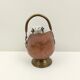 Copper pot cover and a pitcher-style brass handle
