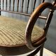 Thonet-branded bistro-style bench in turned wood, velvet and caning