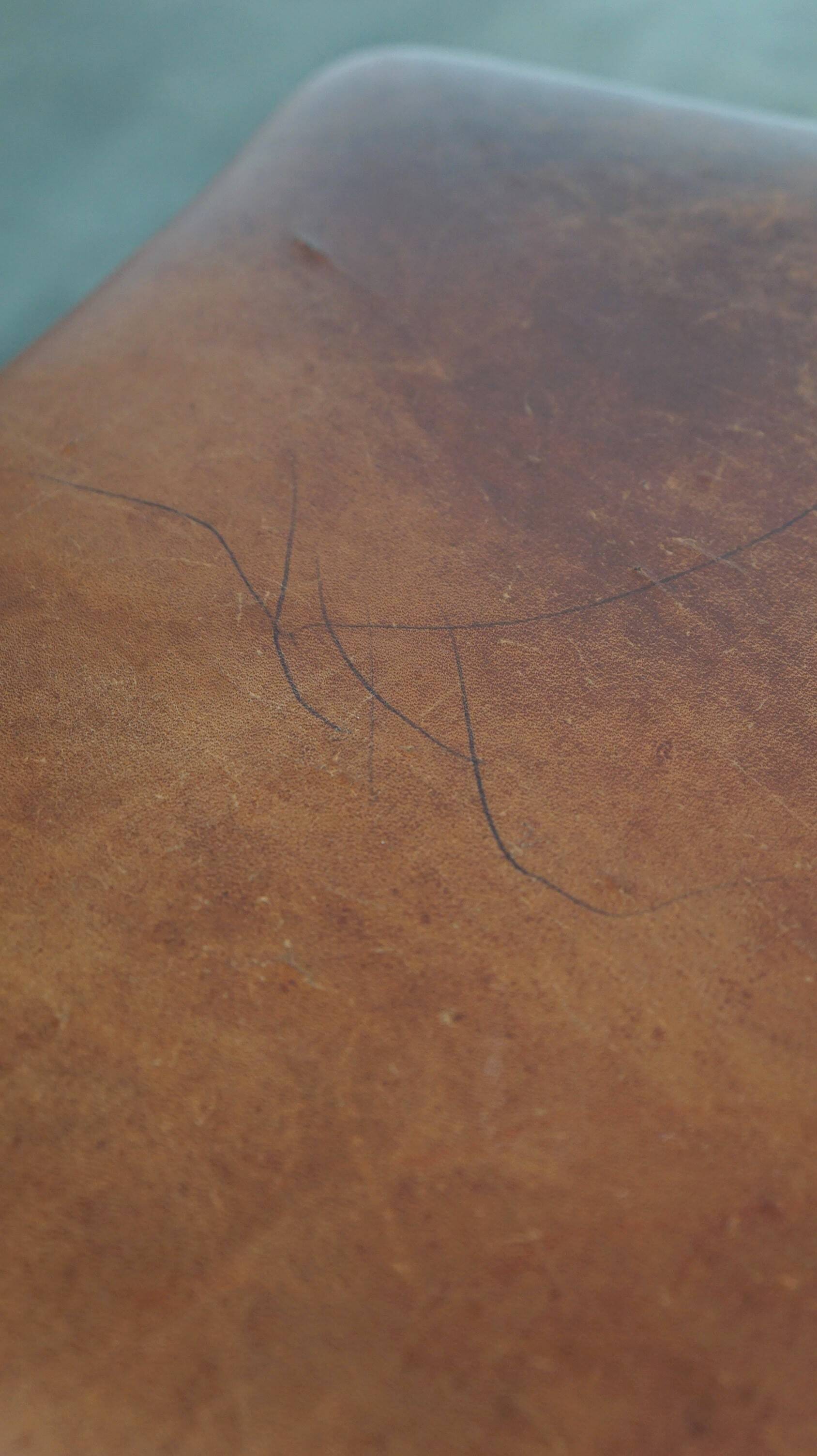 Leather ottoman in classic English style finished with decorative nails