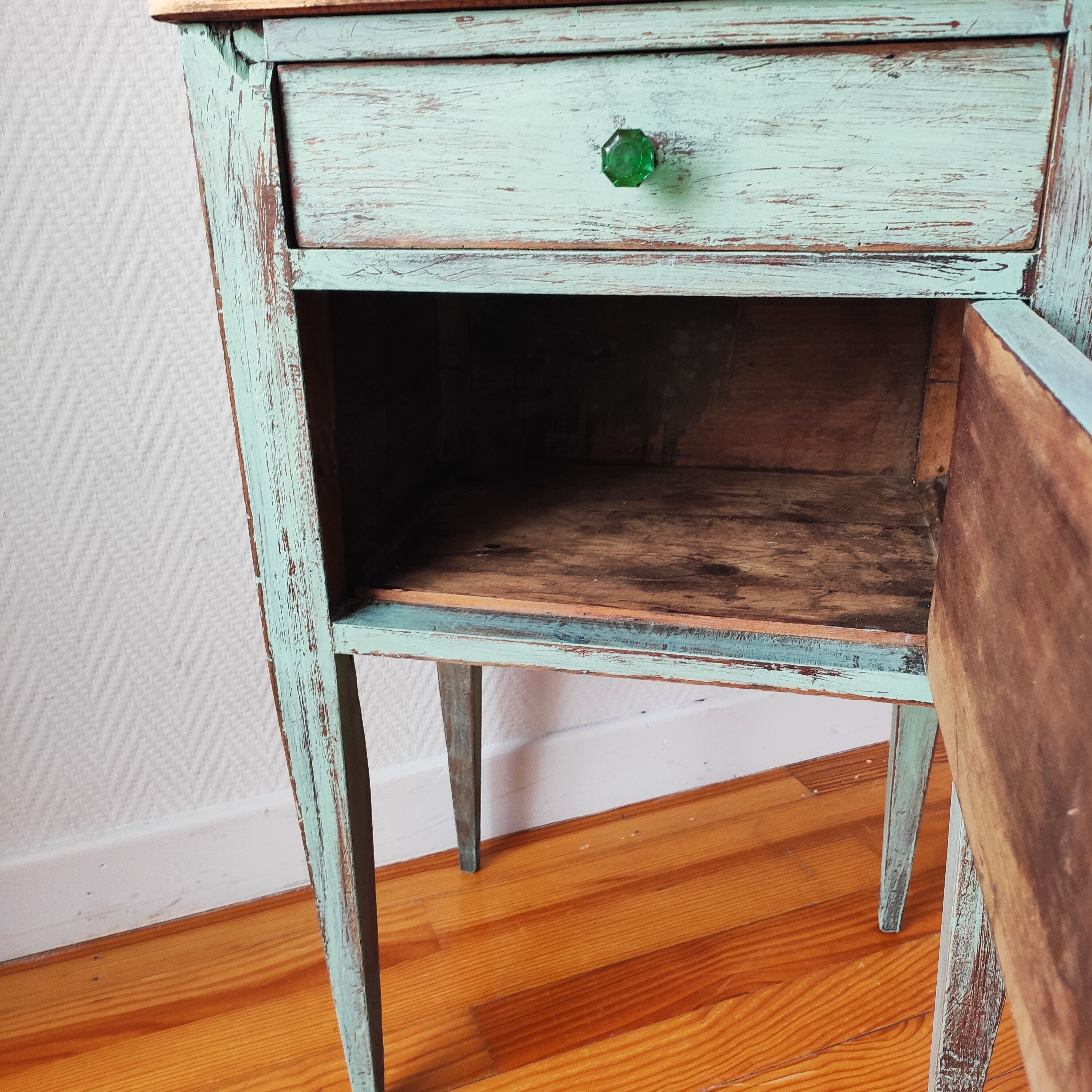 Patinated bedside table end of sofa