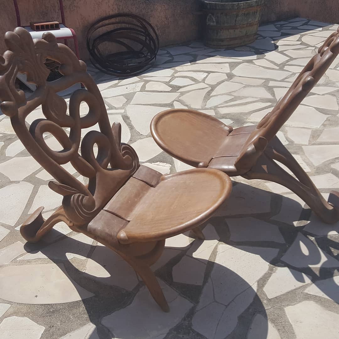 Pair of solid mahogany armchairs from Madagascar, circa 1950