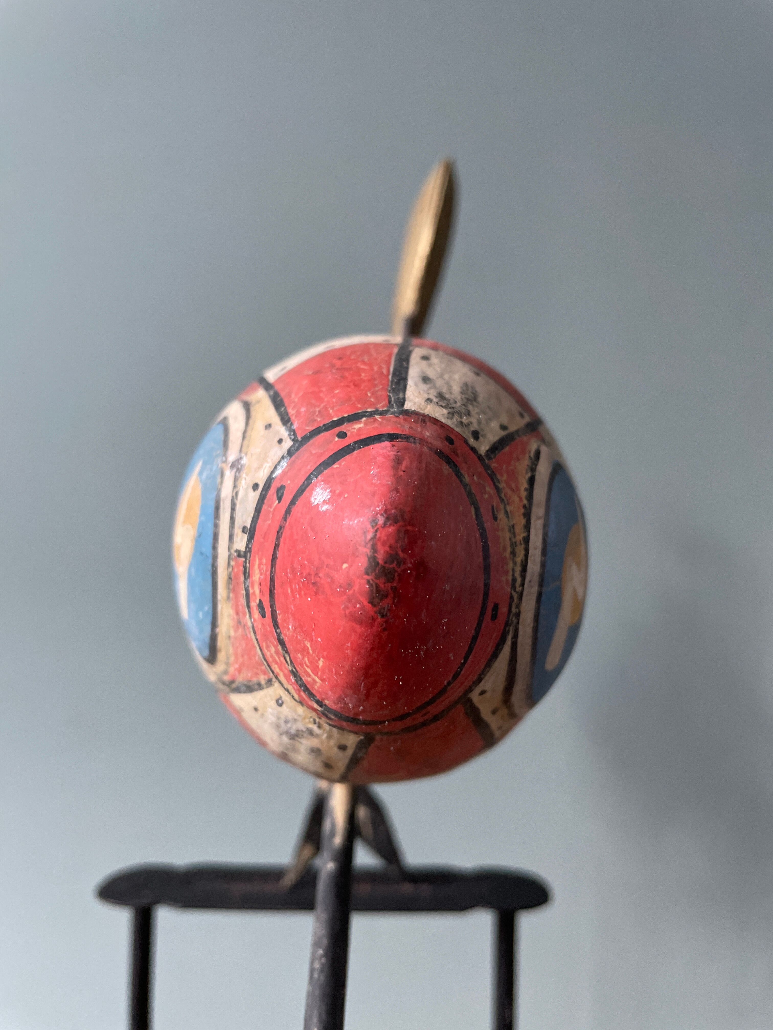 Old painted sheet metal pendulum toy