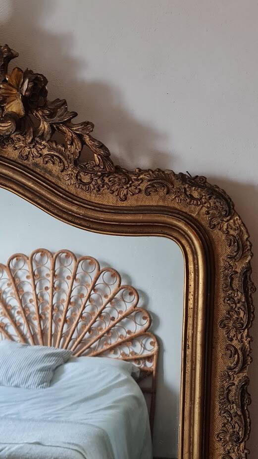 Antique Louis Philippe mirror with a pediment.