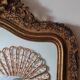 Antique Louis Philippe mirror with a pediment.