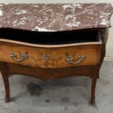 Curved and inlaid Louis XV style chest of drawers