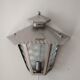 Half grey metal wall sconce and 3 windows