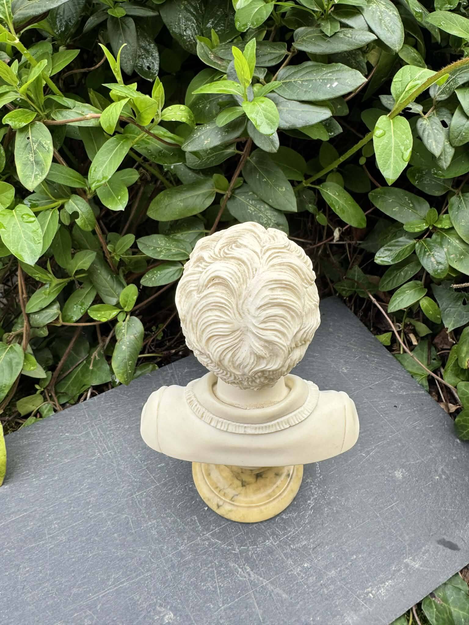 Alabaster bust of a woman signed Arnaldo Giannelli.