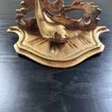 Golden console in rococo style