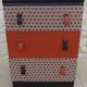 Vintage commode on wheels with three drawers in faux leather and fabric - end.