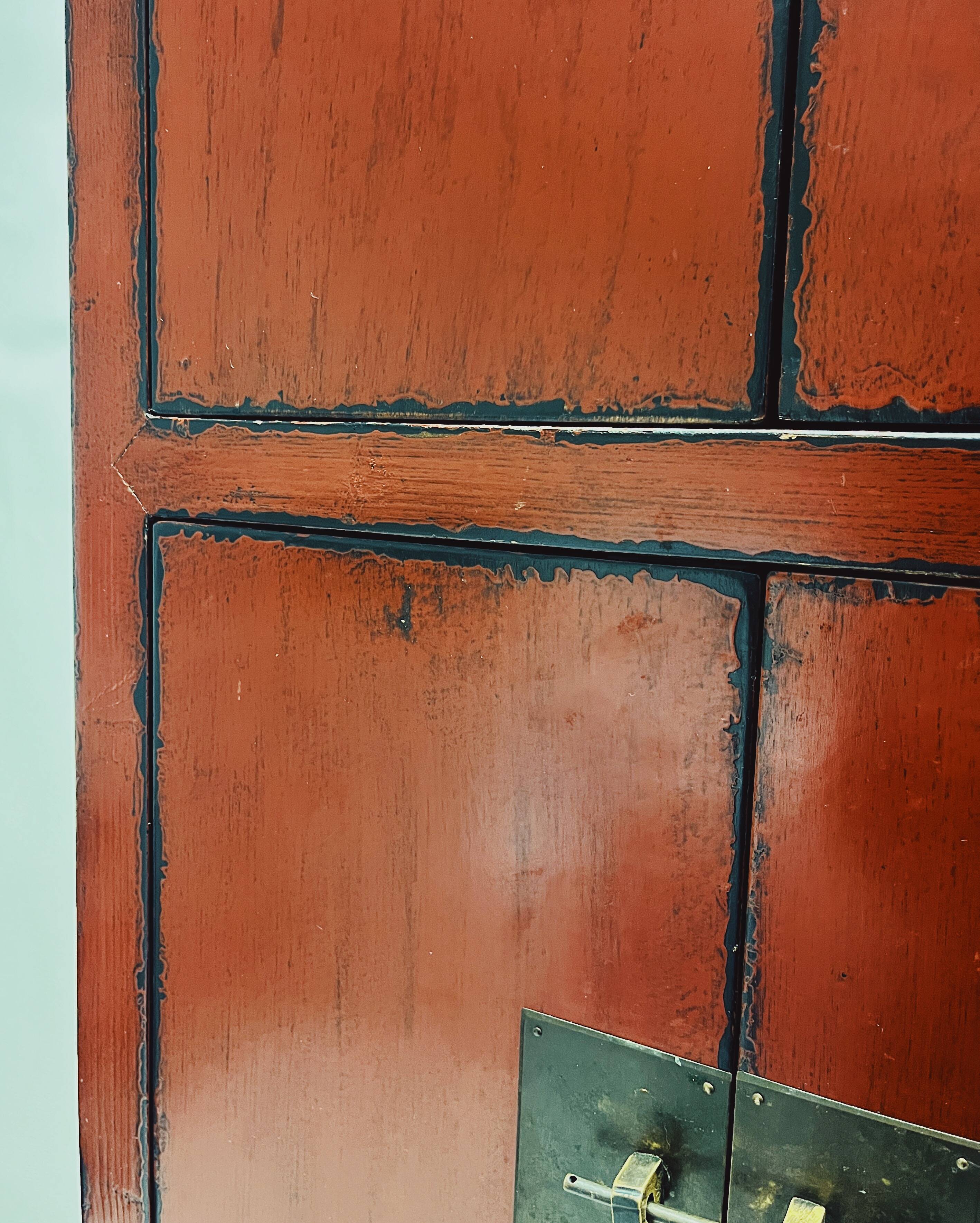 Red Chinese cabinet with three doors
