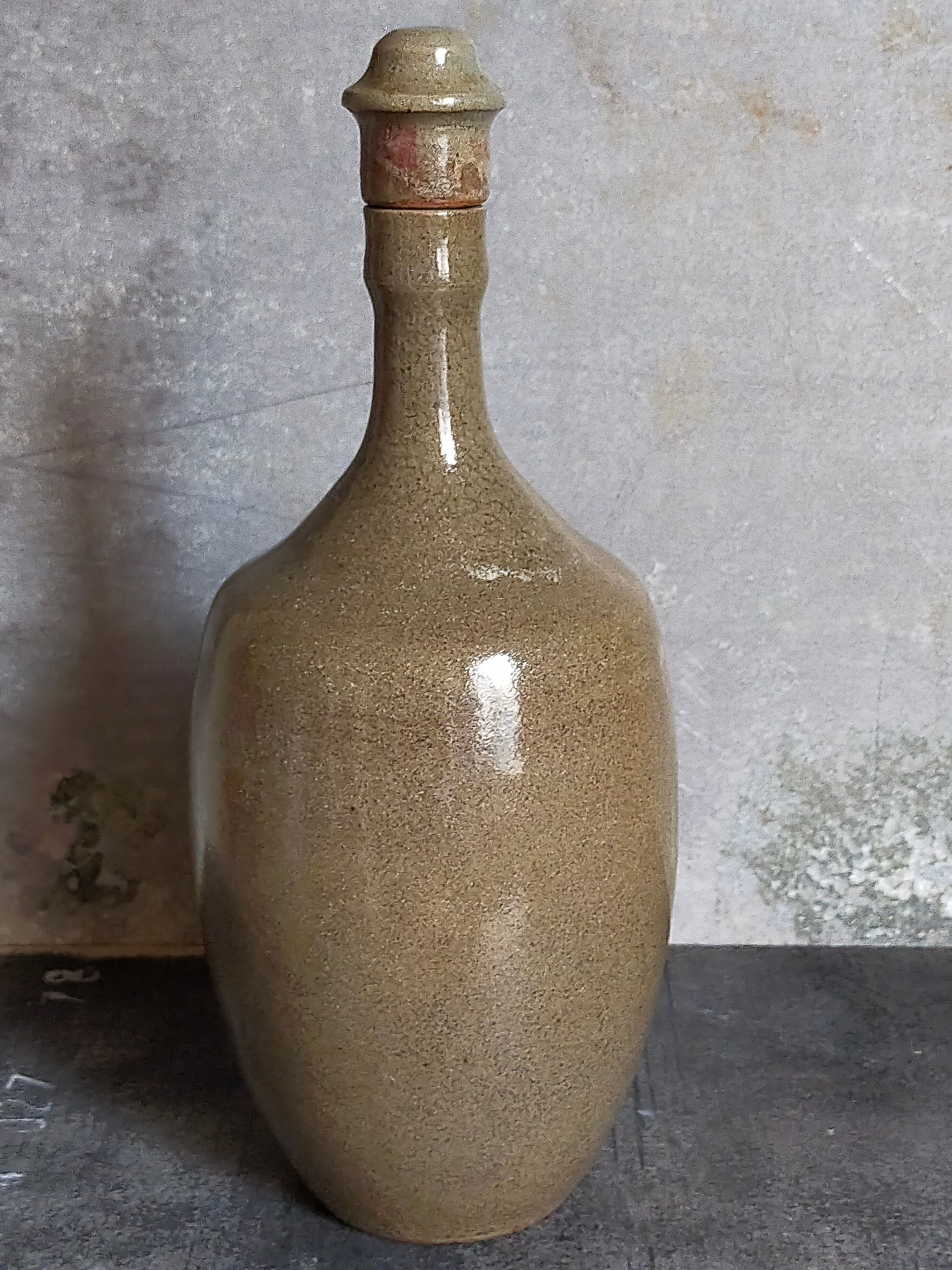 Vintage glazed stoneware potter's liquor bottle