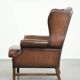 Cowhide wingback armchair in English style finished with decorative nails